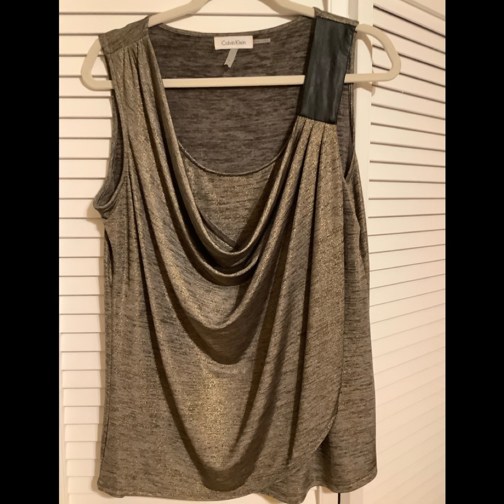 Metallic stretch top with leather trim.